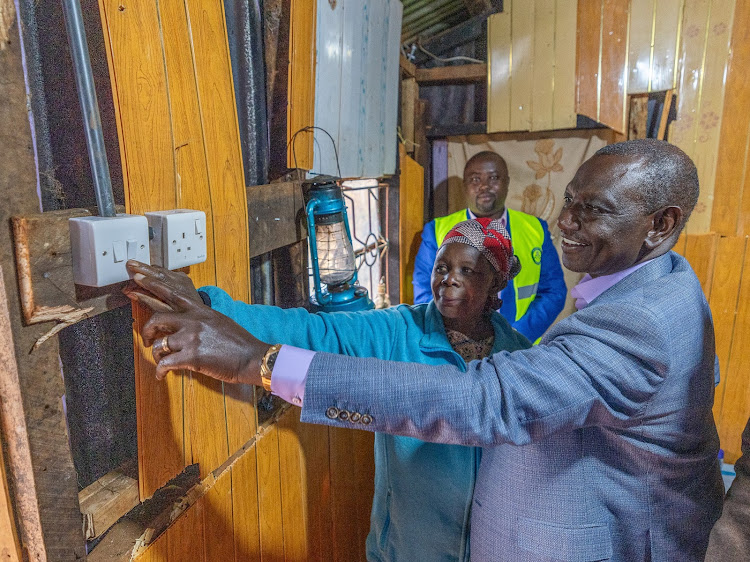 Ruto viewing a newly installed electricity meter box at a local netizens home in kirungu muranga county