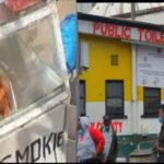 A trolley with street snacks and the kenya bus stop public toilet in Nairobi city