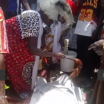 A ritualist perfoming rituals to release the two stuck men