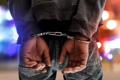 a picture of a man in handcuffs PHOTO| Istock