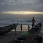 Youth in senegal gather at the beach in sunset PHOTO| Los Angeles Times