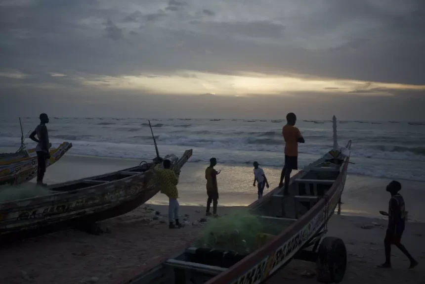 Youth in senegal gather at the beach in sunset PHOTO| Los Angeles Times